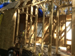 Almost a "cutaway" view of the frame, sheathing, and house wrap process. 